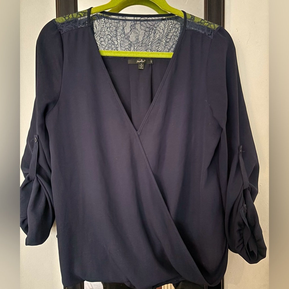 Navy blue soft flowy quarter length sleeve blouse with lace embellishment.